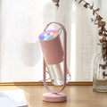 Vit mini-luftfuktare med färgglad projektion