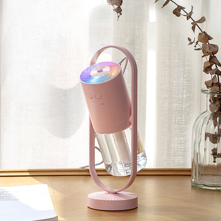 Vit mini-luftfuktare med färgglad projektion