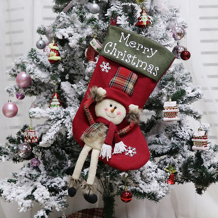 Julstrumpa med tomte och dinglande ben